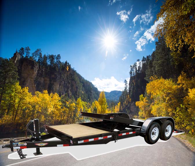 H&H gravity tilt bed trailer black wood decking